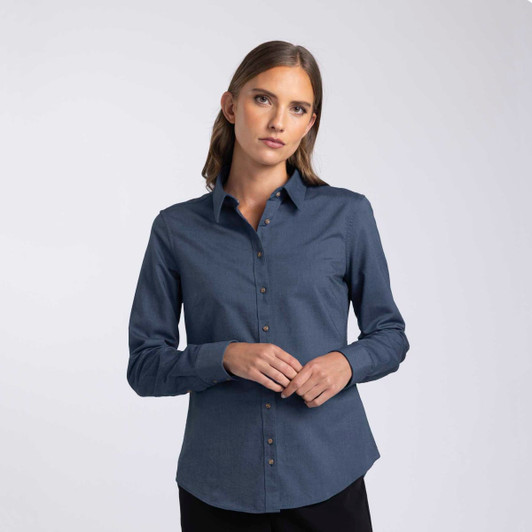 A button-up women's shirt in dark blue with a collar and a logo. Features a fitted design and long sleeves.
