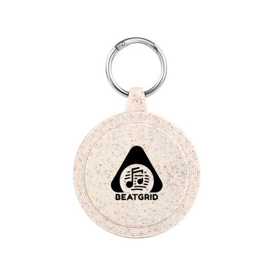 A round, speckled beige keychain with a metal ring and a logo featuring a triangle and musical notes.
