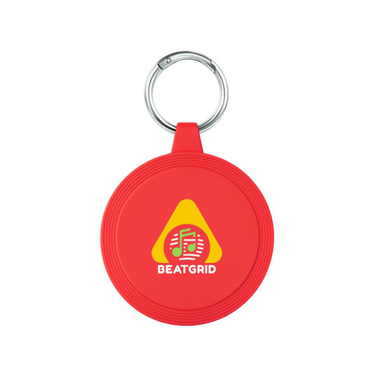 A red circular keychain with a metal ring and a logo on its surface.