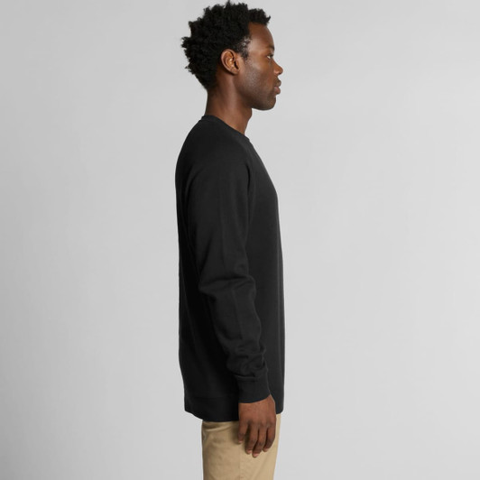 A black jumper with long sleeves, featuring a side view of a person wearing it. The product includes a logo.