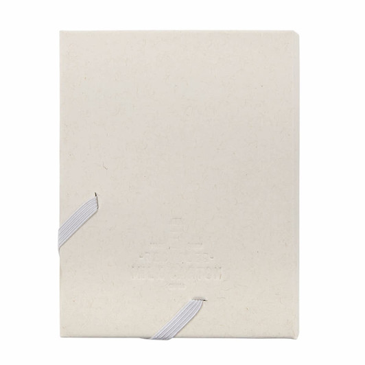 A beige, bound planner with a textured cover, featuring white ribbon ties and an embossed logo.