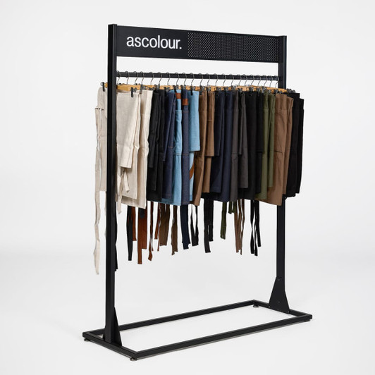 A display rack featuring various pairs of shorts in different colours, with a logo at the top.