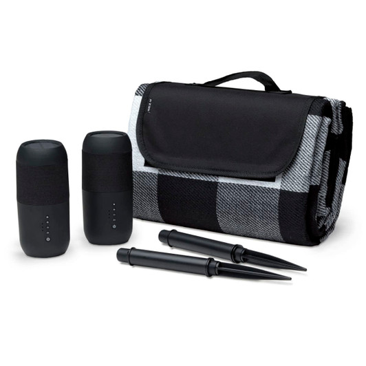 A black and grey checked blanket set, featuring two black speakers and two black stakes.