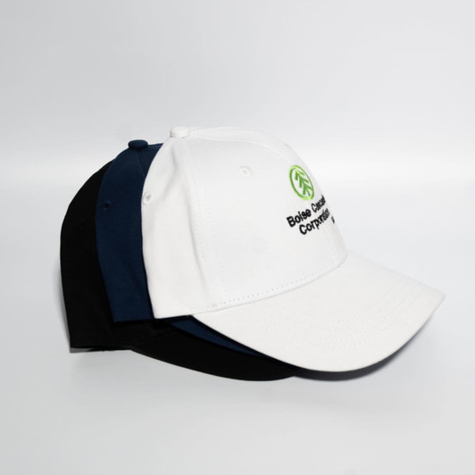 A white, navy, and black Snapback cotton baseball cap with a logo on the front.