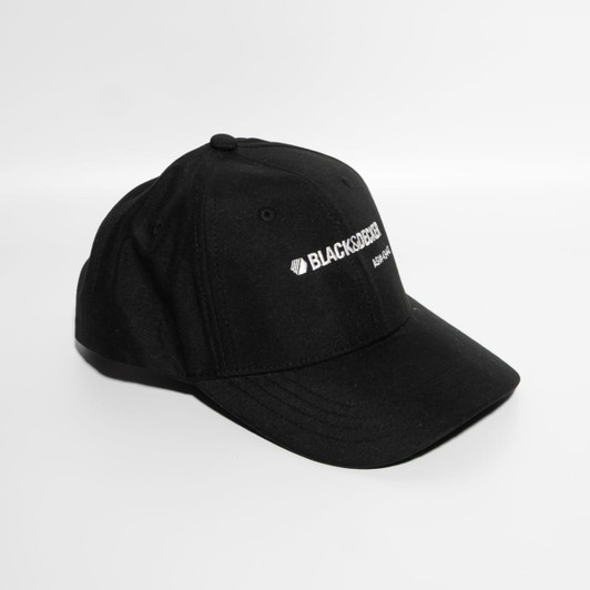 A black strapback baseball cap with a logo on the front. The cap features a rounded crown and a curved brim.