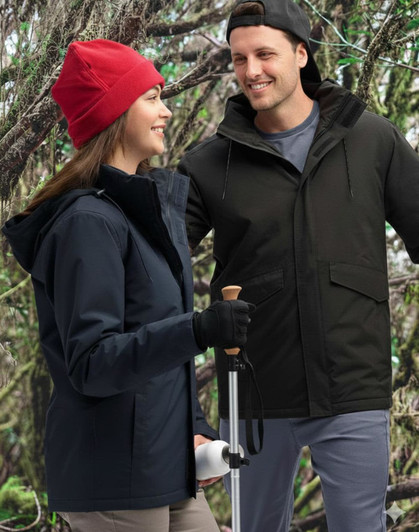 A unisex quilted waterproof jacket in navy and black, displayed by a man and woman in a forest setting.