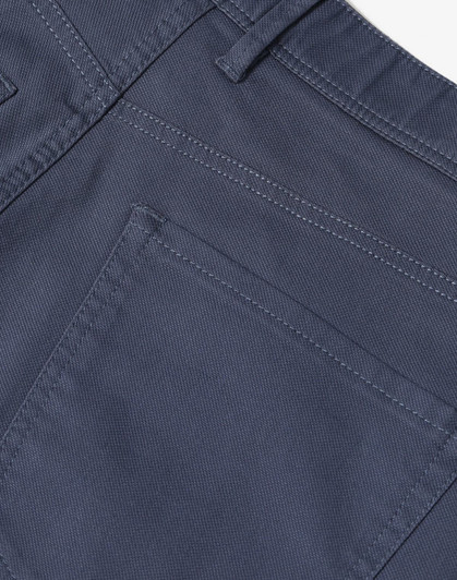 Men's flexi chino pants in grey featuring detailed stitching and a back pocket design. Includes branding on the waistband.
