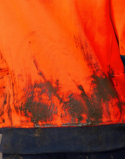 A Hi-Vis two-tone water-resistant fleece hoodie in orange, featuring a soiled fabric texture and a navy blue hem.