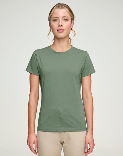 A green ladies' premium cotton short-sleeve tee shirt displayed on a model, featuring a simple design and a logo.