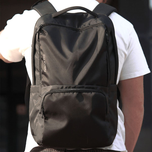A black backpack with multiple compartments and a logo, designed for carrying laptops and other items.