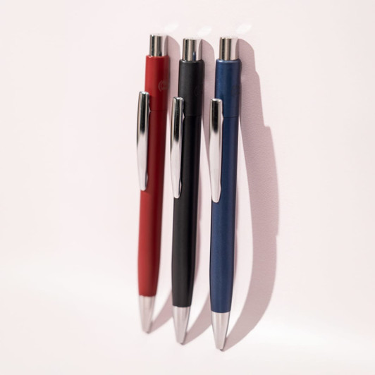 Three ballpoint pens in red, black, and blue, featuring shiny silver accents and a sleek design.