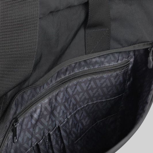 An open black laptop bag interior displaying pocket compartments and a patterned lining. The bag features a branding logo.