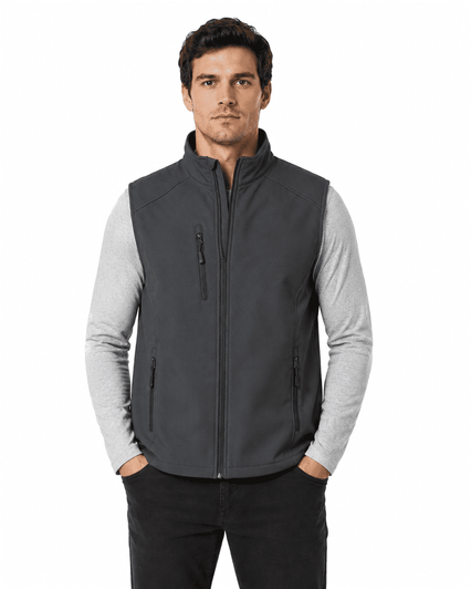 A man is wearing a grey OLYMPUS vest over a long-sleeve shirt, featuring a zipped front and side pockets.