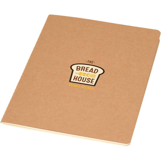 A tan A5 cahier planner with a logo featuring a loaf of bread and text.