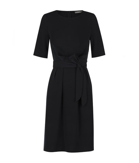 A black dress featuring a fitted bodice, short sleeves, and a tied waist detail. It has a branding label on the back.