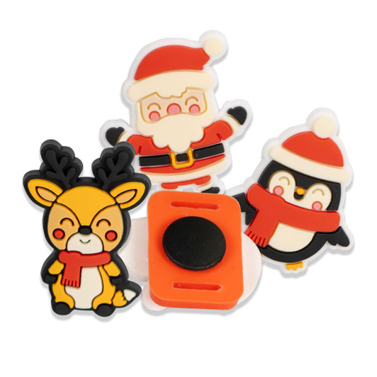 Four colourful custom shoe charms featuring a Santa, reindeer, and penguin in festive attire. One charm has an orange connector.