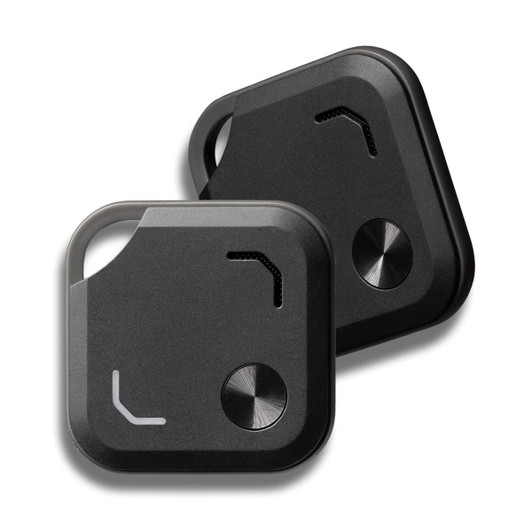 Two black VibeTag Bluetooth trackers, featuring a sleek design with buttons and a logo.