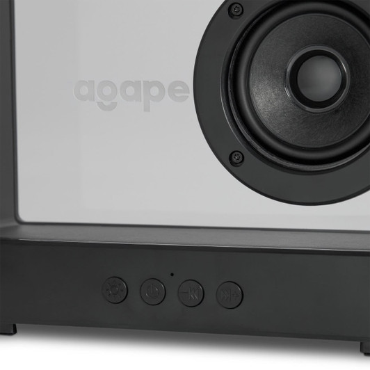 A speaker with a white front and dark grey base, featuring a circular speaker grille and control buttons.