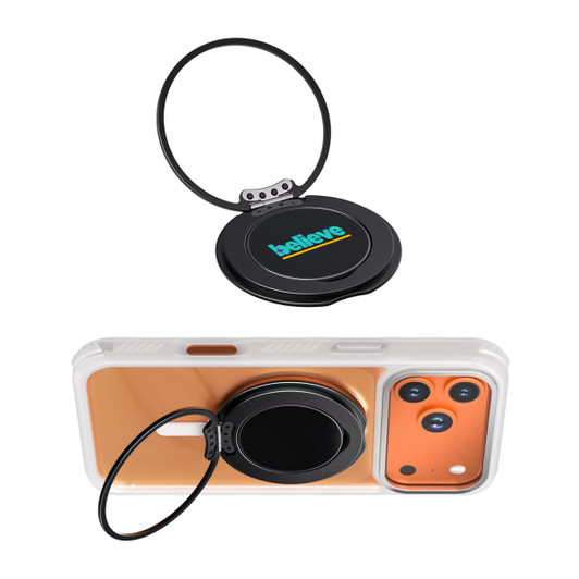 A black phone grip and stand with a circular design, featuring a logo, positioned on an orange phone case.