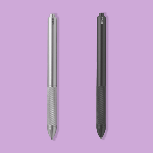 A metal pen set featuring a silver pen and a black pen with textured grips. Both pens have a branding logo.