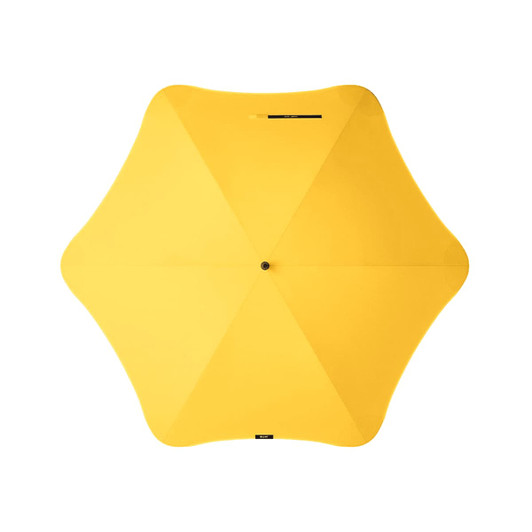A yellow umbrella with a unique star shape, featuring a central button and a logo.