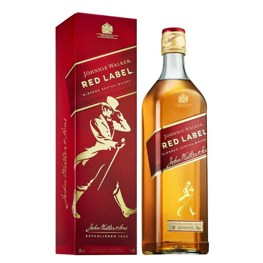A drink bottle of whisky in a red box, featuring a logo, with a golden-yellow liquid.