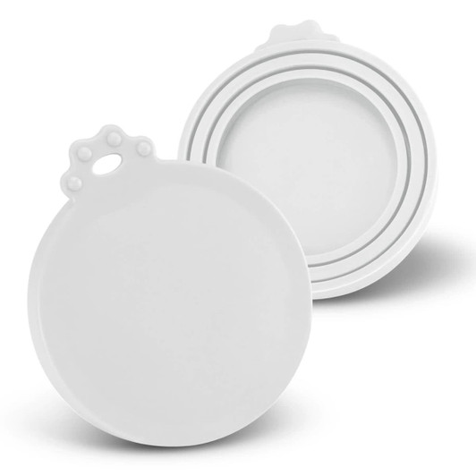 Two white silicone reusable can lids, one positioned above the other, featuring a decorative handle.