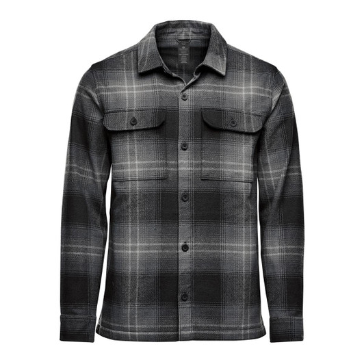 A men's shacket in a black and grey Highland plaid pattern, featuring two chest pockets and long sleeves.