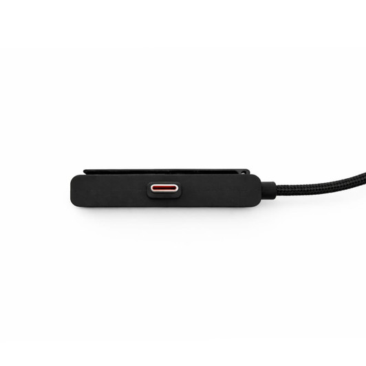 A power cable in black with a textured finish and a red accent, featuring a woven cord. It has a logo on one side.