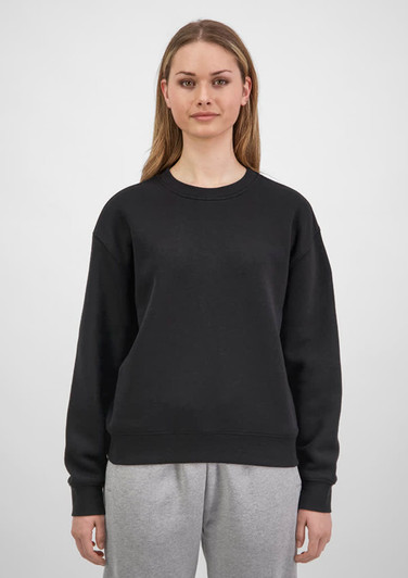 A black women's crew sweatshirt is displayed on a model, featuring a relaxed fit and long sleeves.