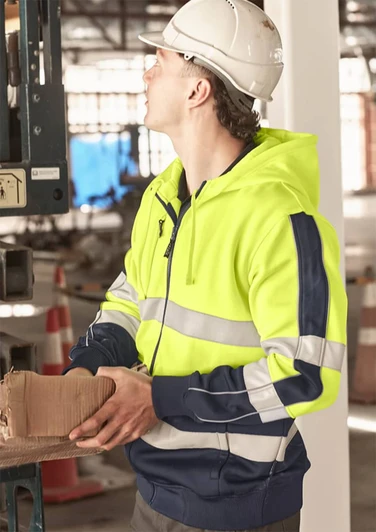 A bright yellow and navy unisex hoodie featuring reflective tape and a logo, worn by a person in a construction setting.