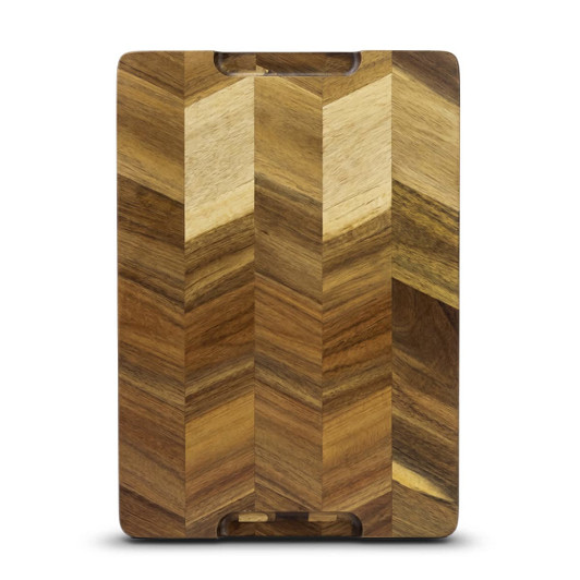 A wooden chopping board featuring a chevron pattern in various shades of brown. It has a logo on the surface.