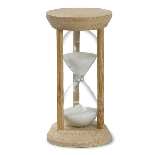 An hourglass with a bamboo frame and clear glass, filled with white sand.
