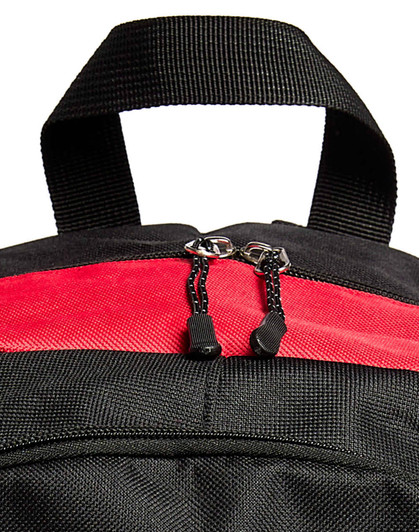 A black and red backpack with a dual zip closure and a top handle. It features a textured fabric and has a logo.