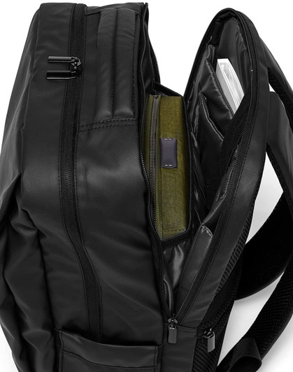 A black PU backpack with multiple compartments and zippers, showcasing interior storage options.