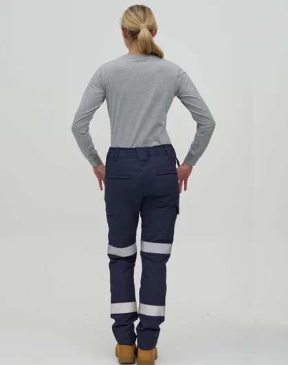 A pair of navy work pants with reflective tape, worn with a grey long-sleeve shirt, seen from the rear.