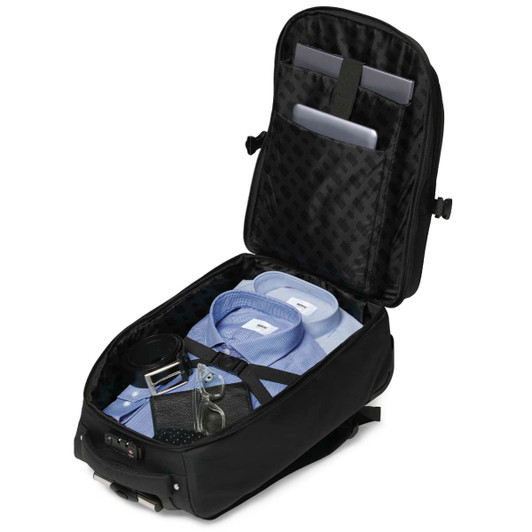 A black trolley backpack with a spacious interior, neatly organised with shirts, accessories, and compartments for devices.