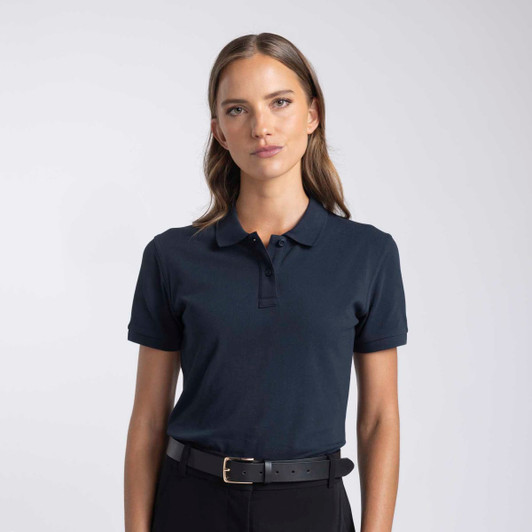 A navy polo shirt for women featuring a collar and short sleeves, paired with a black belt. It has a logo.