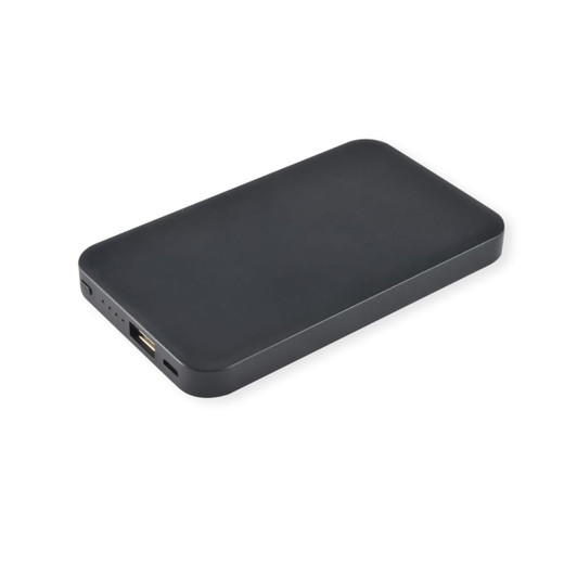 A black wireless power bank with a slim design and an integrated USB port. It features a discrete logo.