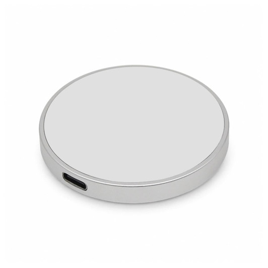 A silver circular wireless charger with a USB-C port, featuring a smooth surface and simple design.
