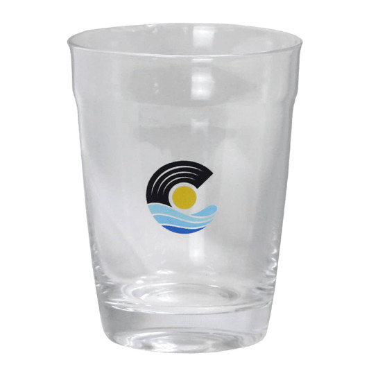 A drink bottle in clear glass featuring a logo with waves and a sun design.