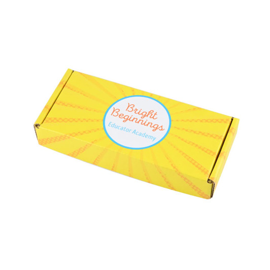 A custom box in bright yellow with a circular logo and stylised sunburst design.