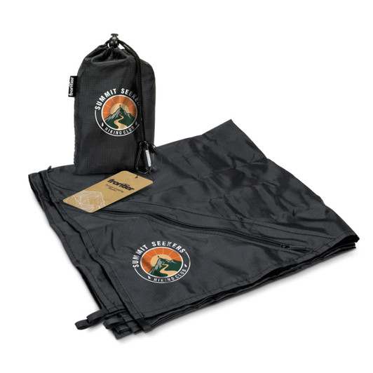 A black camping blanket laid out, with a matching carry pouch and a logo displayed on both items.