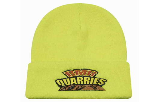 A luminescent yellow beanie with a logo and a folded cuff.