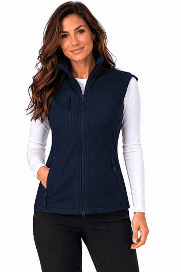 A woman models a navy blue work vest with multiple zippered pockets and a zipped front. The vest has a logo.