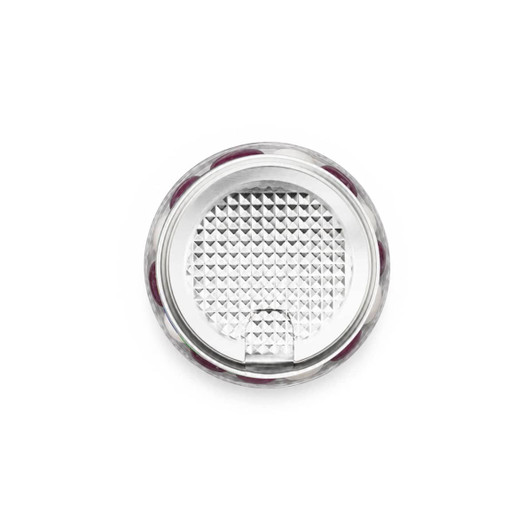 A clear can filled with colourful jelly beans, showcasing a mix of vibrant hues, with a textured silver lid.