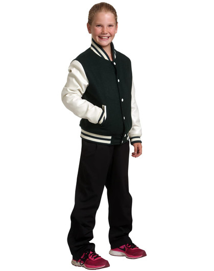 A girl wears a green and cream wool blend varsity jacket with black pants and pink sneakers, smiling confidently.