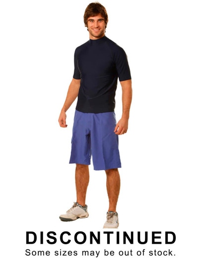 A man wearing navy surf shorts made of 100% polyester, styled with a short-sleeve top. The shorts are a light blue shade.