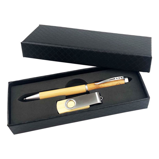 A black gift box containing a wooden pen and a silver USB drive, both neatly arranged inside.