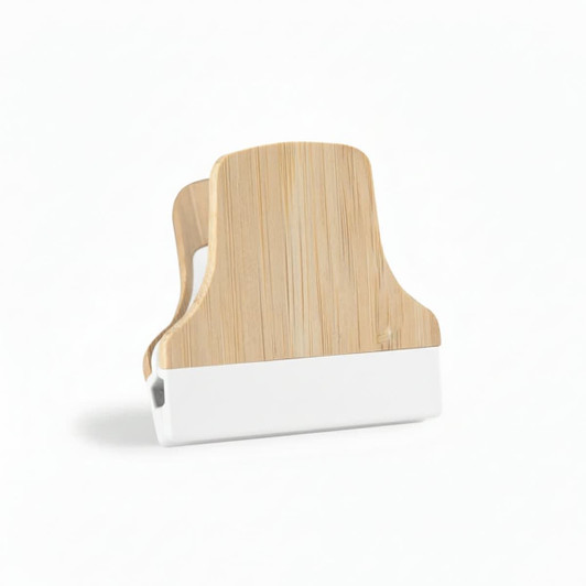 A bamboo fridge magnet clip featuring a natural bamboo finish and a white base. It has a simple, modern design.